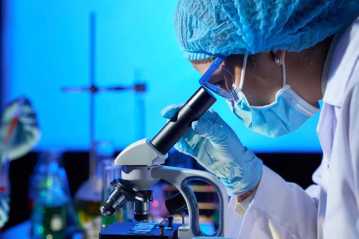 examining-sample-with-microscope_1098-18424